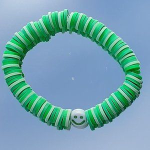 Clay bead stretchy string bracelet When you buy 2 you get 1 free bracelet!